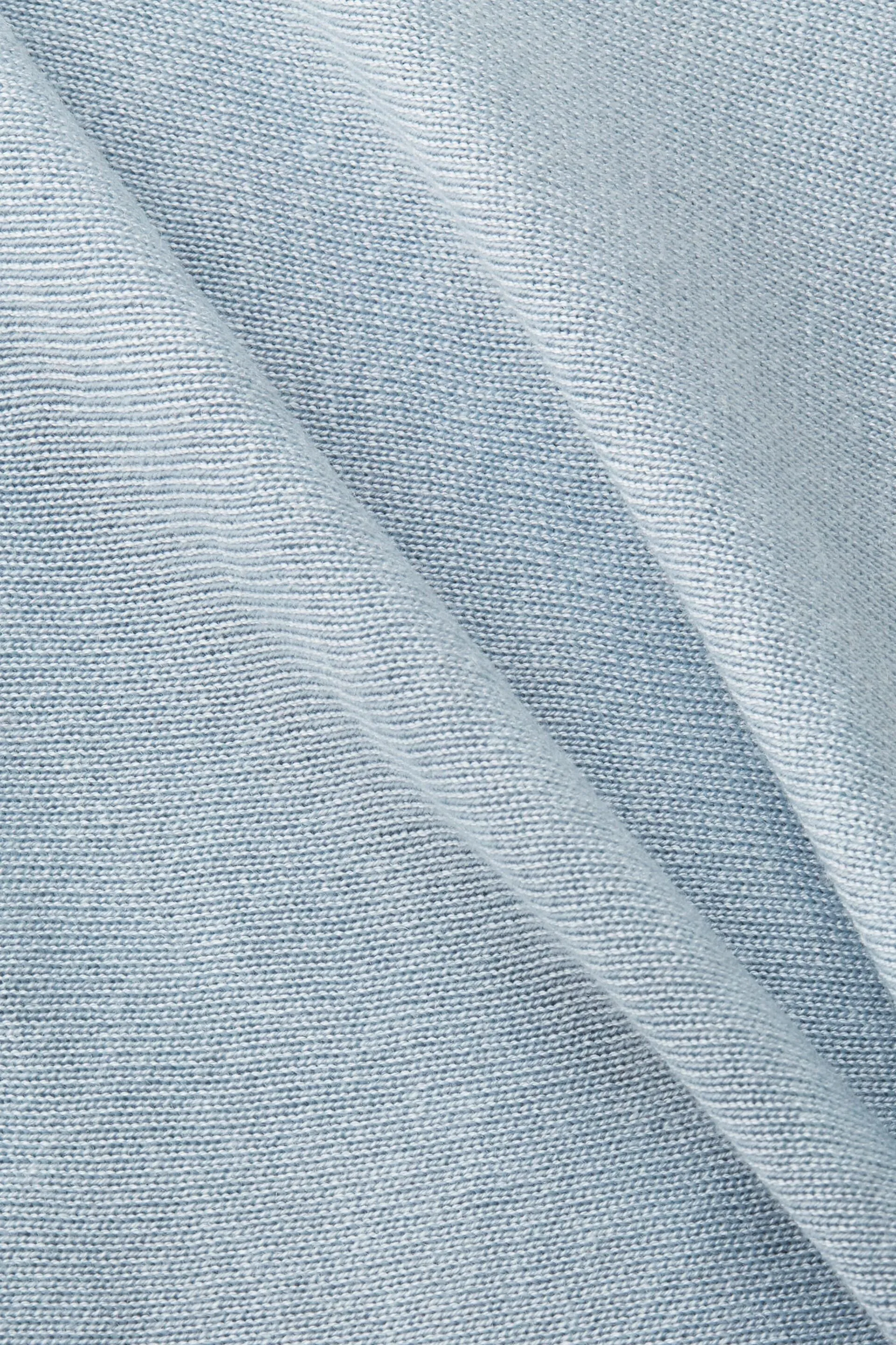 Poncho con fondo a fazzoletto