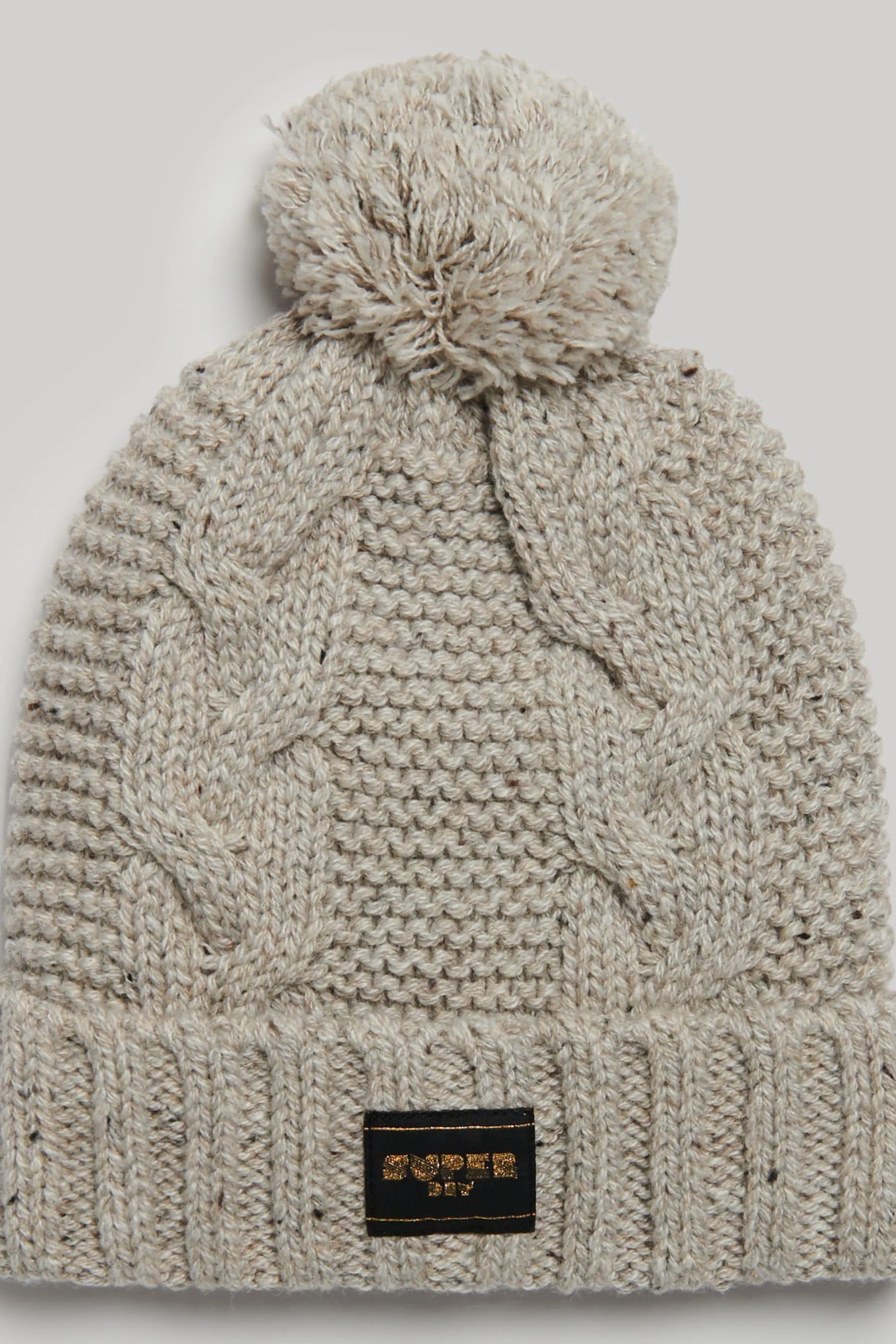 Superdry - Cappello con pompon lavorato a trecce